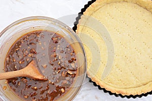 Making pecan pie - nutty pie filling and pie crust