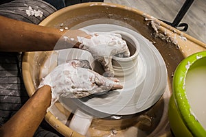 Close-up of potter making pot in pottery workshop