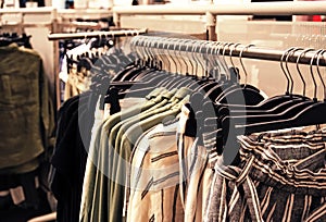 Making a purchase at a clothing store. store of women& x27;s clothing. In foreground is hanger with clothes