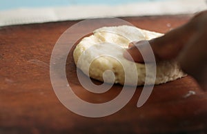 Making roti with prepared dough