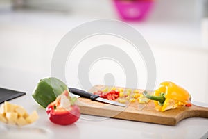 Making salad for lunch in modern kitchen