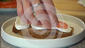 Making a sandwich with cheese. Close-up with male hands