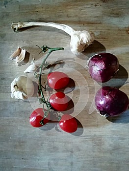 Making sauce for pasta Italy tomatoes onions and  garlic