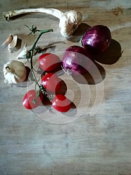 Vegetable diet  tomatoes onions and  garlic photo