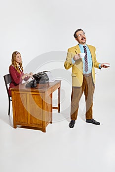 Making daily schedule. Woman, employee writing, typing information, plan on typewriter from boss, manager