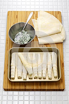 making Sigara borek, Cigar-like Turkish spring rolls.