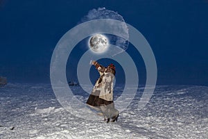 Making Snow with Boiling Water, Far North, girl splashes hot water in minus 40, selective focus