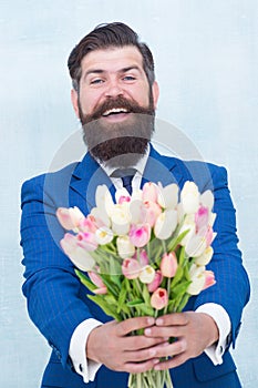 Making surprise. Gentleman with tulips. This is for you. Spring is coming. Greetings. Bearded man tulip bouquet. Womens