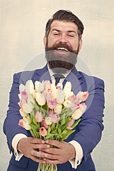 Making surprise. Gentleman with tulips. This is for you. Spring is coming. Greetings. Bearded man tulip bouquet. Womens