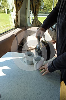 Making tea and coffee in a campervan