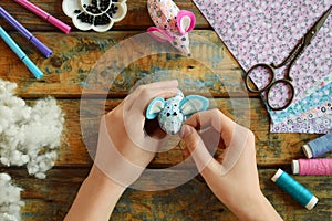 Making textile mouse. Sewing toys with your own hands. DIY concept for children. Handmade crafts.