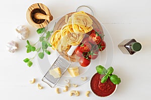 Making tomato pesto, with fresh pasta, parmesan cheese, keshu nuts, basil and olive oil