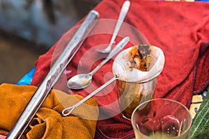 Making traditional Thai milk tea using coffee bag in Stainless Steel Pot. Old Thai tea made shop street food