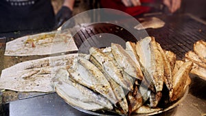 Making traditional Turkish Balik Ekmek street food at evening.