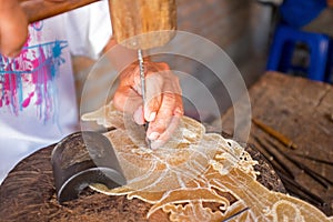 Making tradititional wajang puppet on Java Indonesia