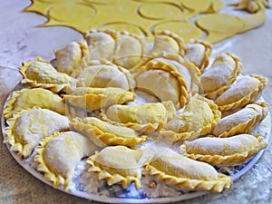 Making varenyky (filled dumplings)