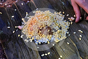 Making zongzi, a traditional Chinese rice dish which is made of glutinous rice