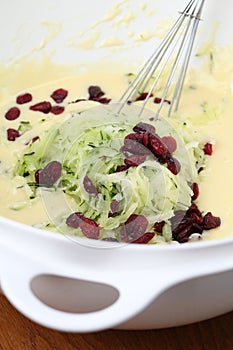 Making zucchini bread with cranberries