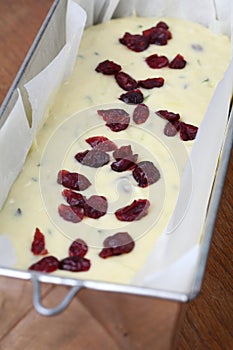 Making zucchini bread with cranberries