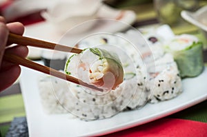 Makis and chopsticks at the chinese restaurant photo