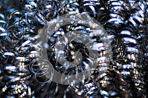 Makro close up shiny silver stainless steel spirals of metal scourer sponge photo