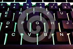 Makro closeup of green illuminated computer keyboard keys