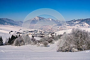 Mala Fatra mountains over Zaskov village from meadows over Komjatna during winter