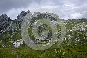 Mala Spice Cime Verdi peaks view from Mangart saddle, Slovenia\'s Highest Panoramic Road, heavy clouds before rain