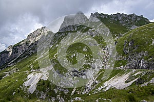 Mala Spice Cime Verdi peaks view from Mangart saddle, Slovenia\'s Highest Panoramic Road, heavy clouds before rain