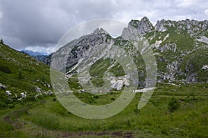 Mala Spice Cime Verdi peaks view from Mangart saddle, Slovenia\'s Highest Panoramic Road, heavy clouds before rain
