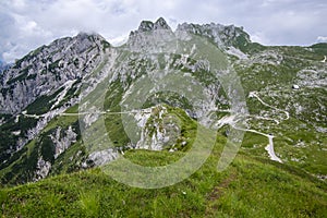 Mala Spice Cime Verdi peaks view from Mangart saddle, Slovenia\'s Highest Panoramic Road, heavy clouds before rain, foggy day