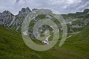 Mala Spice Cime Verdi peaks view from Mangart saddle, Slovenia\'s Highest Panoramic Road, heavy clouds before rain, foggy day