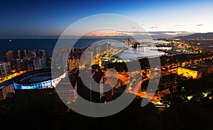 Malaga with Port from castle in twilight time. Spain