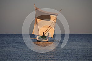 Malagasy fishermen and their outrigger canoes