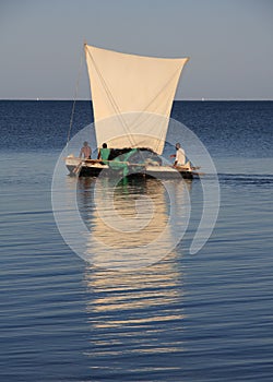 Malagasy fishermen and their outrigger canoes