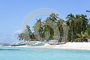 Malapascua island banka fishing boats white sand beach philippines photo