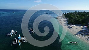 Malapascua Island in Cebu, Philippines. Sulu sea Boat and Beautiful Bounty Beach, Seascape with Boats in Background III