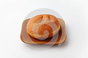 malasada portuguese hawaiian doughnut on plate on white background