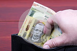 Malawian money in the black wallet