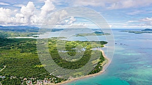 Malay archipelago with reefs and islands. Seascape with islands in the early morning, aerial drone . Caramoan Islands, Philippines