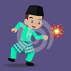 Malay boy happy playing firework in the hari raya aidilfitri