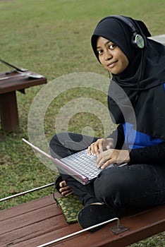 Malay female teen study laptop