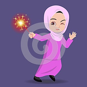 Malay girl happy playing firework in the hari raya aidilfitri