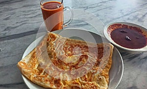 Malaysia breakfast roti canai and teh tarik