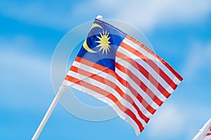 Malaysia flag against blue sky