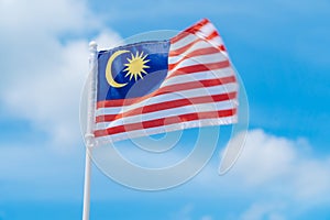 Malaysia flag against blue sky