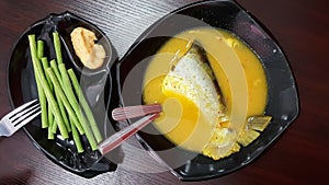 Malaysia Traditional Dish, Patin tempoyak stews served with long beans kacang panjang served with tempoyak photo