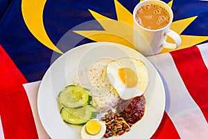 Malaysian Breakfast - Nasi Lemak and Teh Tarik on Malaysia Flag.