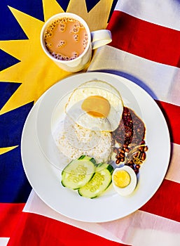 Malaysian Breakfast - Nasi Lemak and Teh Tarik on Malaysia Flag.