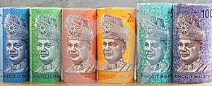 Malaysian currency, Money rolls, Ringgit banknotes lined up in a row, panorama